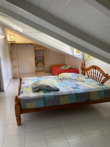 Postel nebo postele na pokoji v ubytování Villa MORINGA