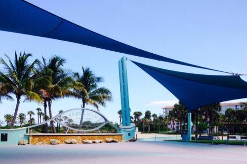 a view of a theme park with a roller coaster at Blue Hideaway With Shared Spaces in Riviera Beach