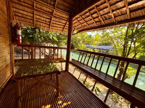 a view from the inside of a building with a balcony at ข้าวทุ่งเบ็ญจาโฮมสเตย์ in Ban Hat Phang