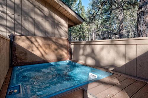 a hot tub in the backyard of a house at Lynx - Unit 3 in Sunriver