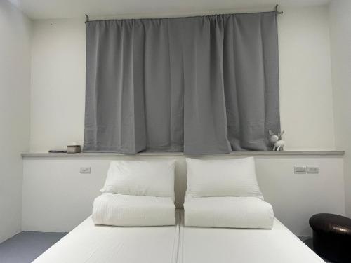 Postel nebo postele na pokoji v ubytování Ye Wong B&B