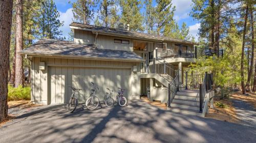 three bikes parked on the side of a house at Diamond Peak - Unit 20 in Sunriver