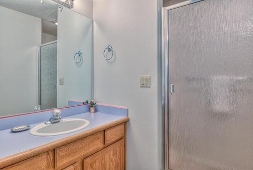 a bathroom with a sink and a shower at Red Cedar - Unit 30 in Sunriver