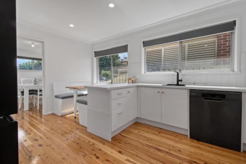 A kitchen or kitchenette at Morgan Abode - Walk to CBD, Modern Escape