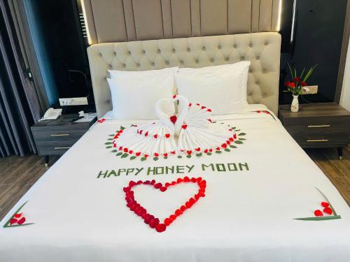 a bed with a heart made out of roses at Le Anh Hotel in Phu Quoc