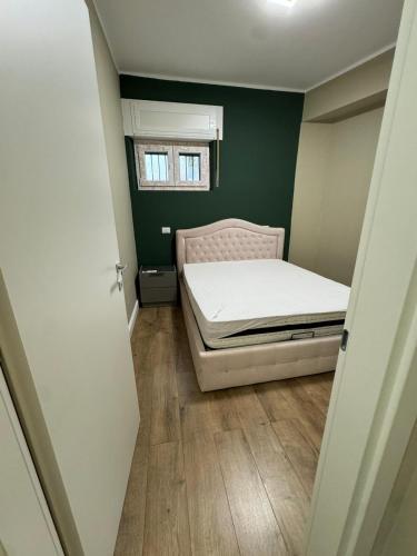 a small bedroom with a bed and a window at Il Rifugio in Piazza in Castel di Sangro