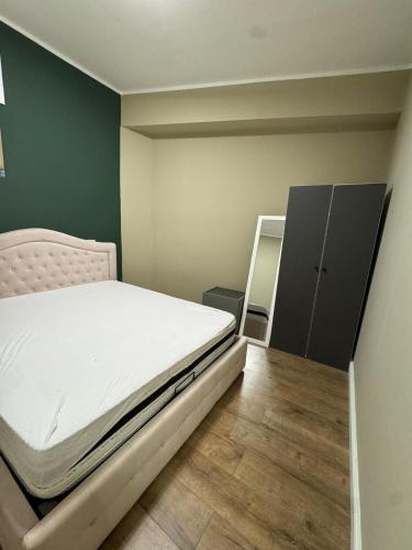 a small bedroom with a bed and a mirror at Il Rifugio in Piazza in Castel di Sangro