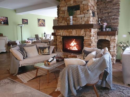 Posezení v ubytování Poiana Golf Chalet