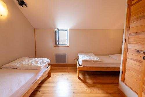 Katil atau katil-katil dalam bilik di Gîte Montbuisson 8/10 personnes
