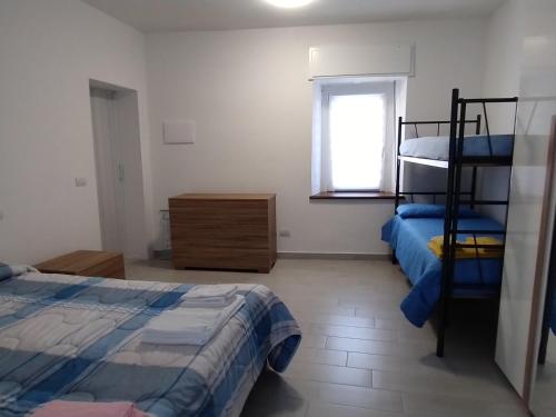 Ένα ή περισσότερα κρεβάτια σε δωμάτιο στο Appartamento AchiRosa