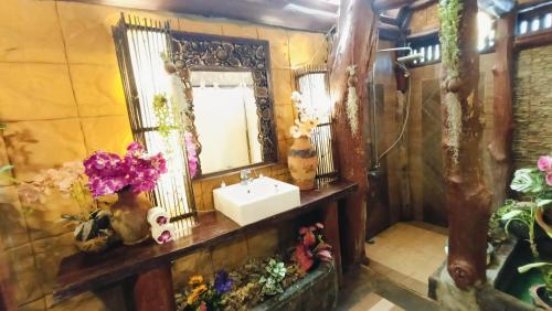 a bathroom with a sink and a mirror at P P Garden Home Bungalow in Phi Phi Don