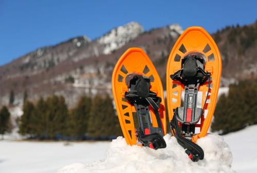 an orange pair of skis sticking out of the snow at Locanda Romana in Fanano