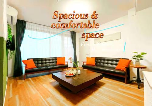 a living room with two couches and a coffee table at Easily to Nishi-Nippori Shibuya Asakusa For 10 in Tokyo