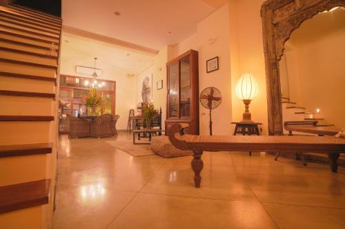 a living room with a mirror and a couch at The Merchant in Galle