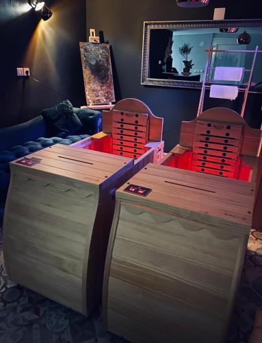 a living room with two chairs and a table at Rooms & Apartment ZALA in Cerklje na Gorenjskem