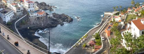 an aerial view of a city and the ocean at Apartamento Lago Panoramic Ocean Views in Puerto de Santiago