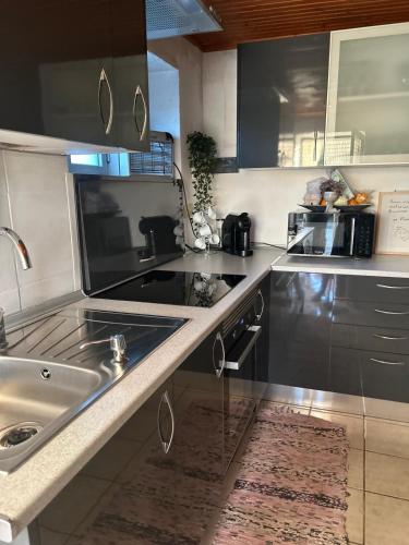 a kitchen with a sink and a counter top at Casa Dora in Ferro