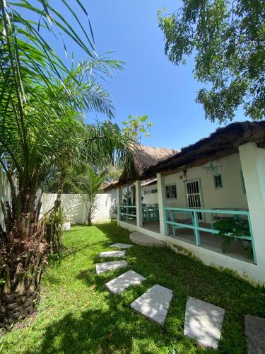 a house with a garden in front of it at Oasis club in Cap Skirring