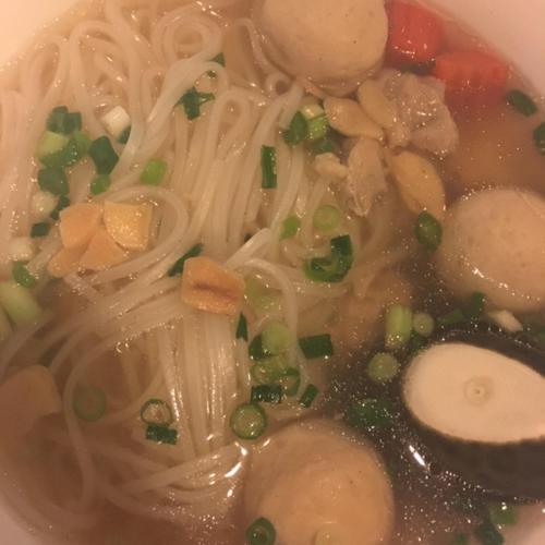 a bowl of soup with noodles and vegetables in it at Onomichi View Hotel Seizan in Onomichi