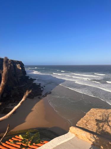 an aerial view of a beach with the ocean at Casa Condessa - Create memories in Azenhas do Mar
