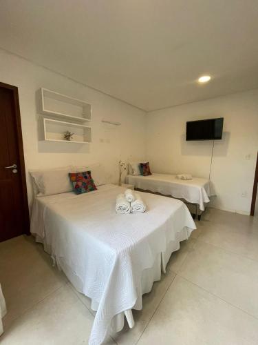 Katil atau katil-katil dalam bilik di Suites Amma Noronha