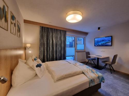 Posteľ alebo postele v izbe v ubytovaní St. Florian Appartements