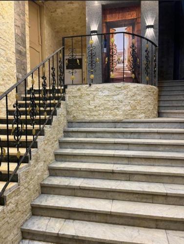 a set of stairs in front of a house at Happy Day Pyramids View Hotel in Cairo
