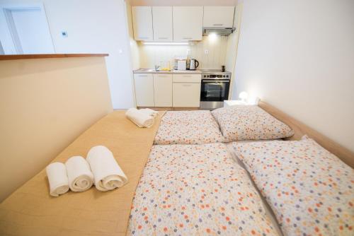 Postel nebo postele na pokoji v ubytování New Cosy Apartment, close to TATRALANDIA and JASNA, parking