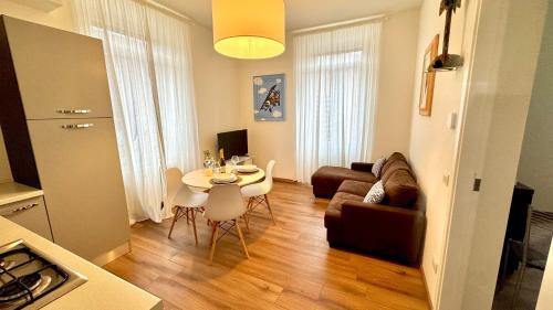 a living room with a table and a couch at AxelParkComo in Como