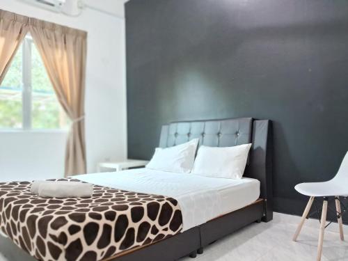 Ένα ή περισσότερα κρεβάτια σε δωμάτιο στο Al Falah Homestay