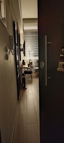 a hallway leading to a living room with a table at Urban Nest Veria downtown in Veria