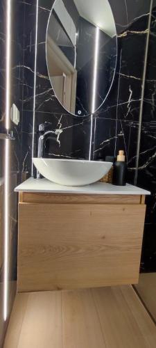 a bathroom with a sink and a mirror at Urban Nest Veria downtown in Veria