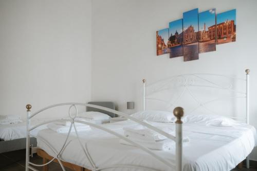 En eller flere senge i et værelse på Home Luca