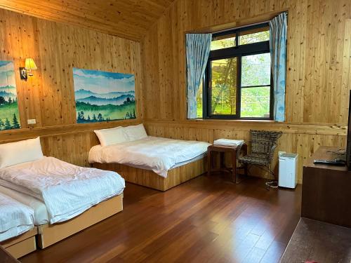 Postel nebo postele na pokoji v ubytování He Ya Leisure Land B&B