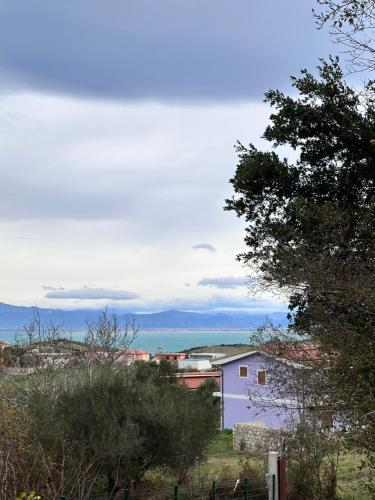 a purple house with a view of the ocean at The Grey Cottage in Durrës