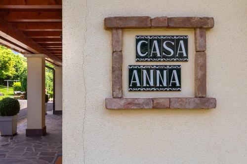 a sign on the side of a building at Casa Anna in Trichiana