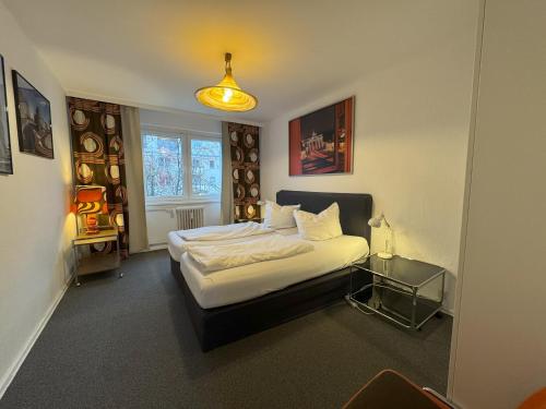 a bedroom with a bed and a glass table at M M Central Vintage Family, Handwerker und Monteure Apartments in Berlin