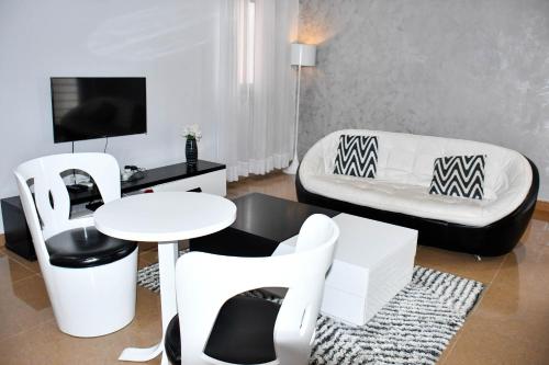 TV a/nebo společenská místnost v ubytování Residence SCI ABBAS