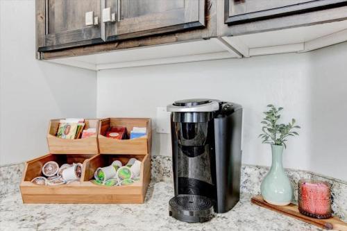 a kitchen counter with a coffee maker on a counter at Golf Course Close By Minutes from UVU BYU in Orem