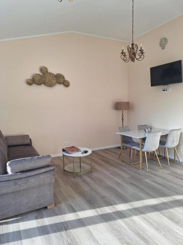 a living room with a couch and a table at Villa Rustica in Xanten