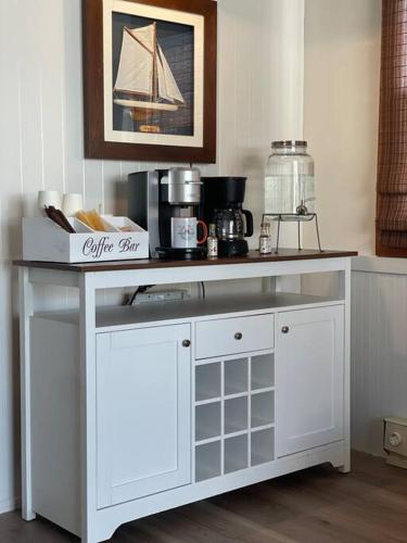a white table with a counter top in a kitchen at Houseboat in Providence! in Providence
