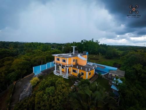 an overhead view of a house in the forest at Huge house with seaview in Daanbantayan