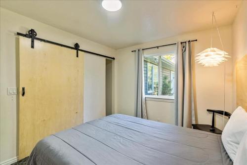 a bedroom with a large bed and a window at Private Room & Bathroom Quiet Neighborhood in Ogden