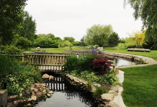 a garden with a bridge and a pond at Private Room & Bathroom Hiking Trails Close By in Ogden