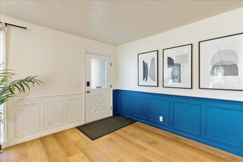 a room with blue and white walls and a door at Private Room & Bathroom Hiking Trails Close By in Ogden