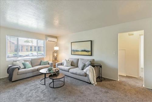 a living room with a couch and a table at Pickle Ball Courts Close By 5 Mins off i15 in Bountiful