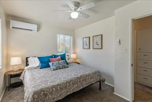 a bedroom with a bed and a ceiling fan at Pickle Ball Courts Close By 5 Mins off i15 in Bountiful