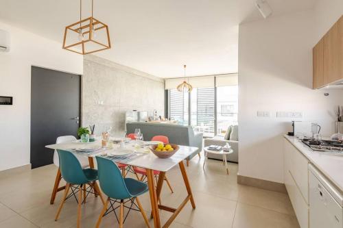 a kitchen and dining room with a table and chairs at PROTEA RESIDENCE with private terrace in Nicosia
