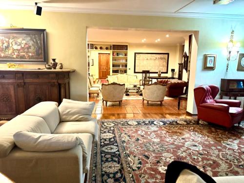 a living room with a couch and chairs at Villa Elena in Montefiascone