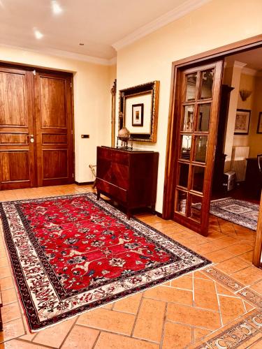 a living room with a rug on the floor at Villa Elena in Montefiascone